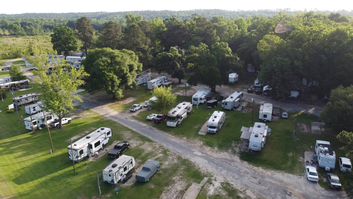Aerial view of Branching Pines RV Park in Fort Mitchell, Alabama, with RV sites among tall trees