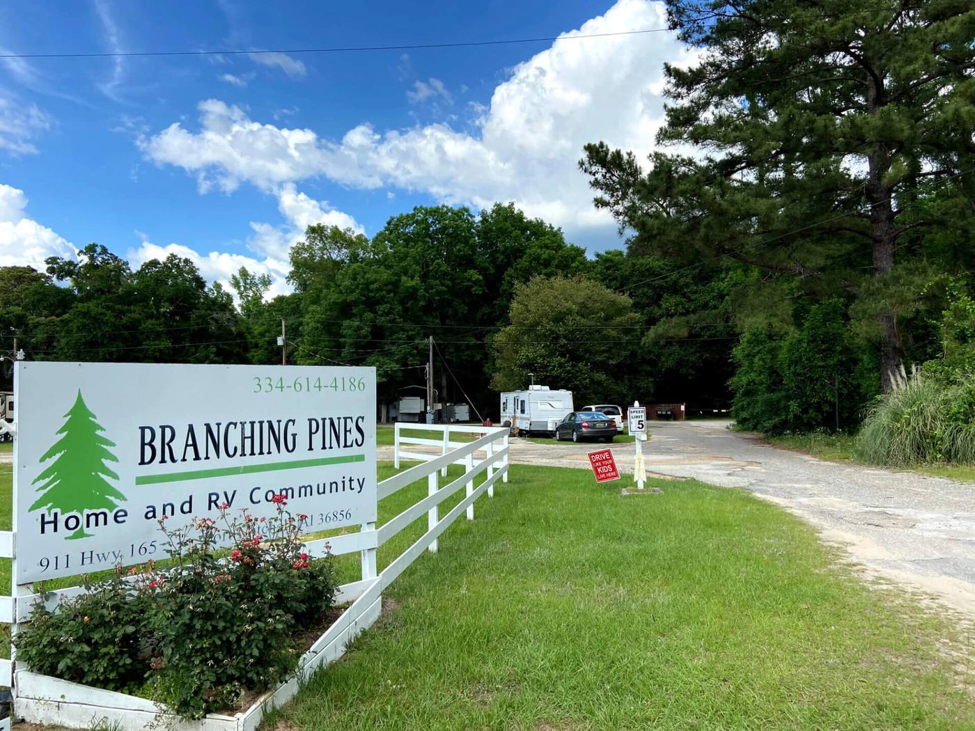 Branching Pines Home and RV Community entrance sign on Highway 165