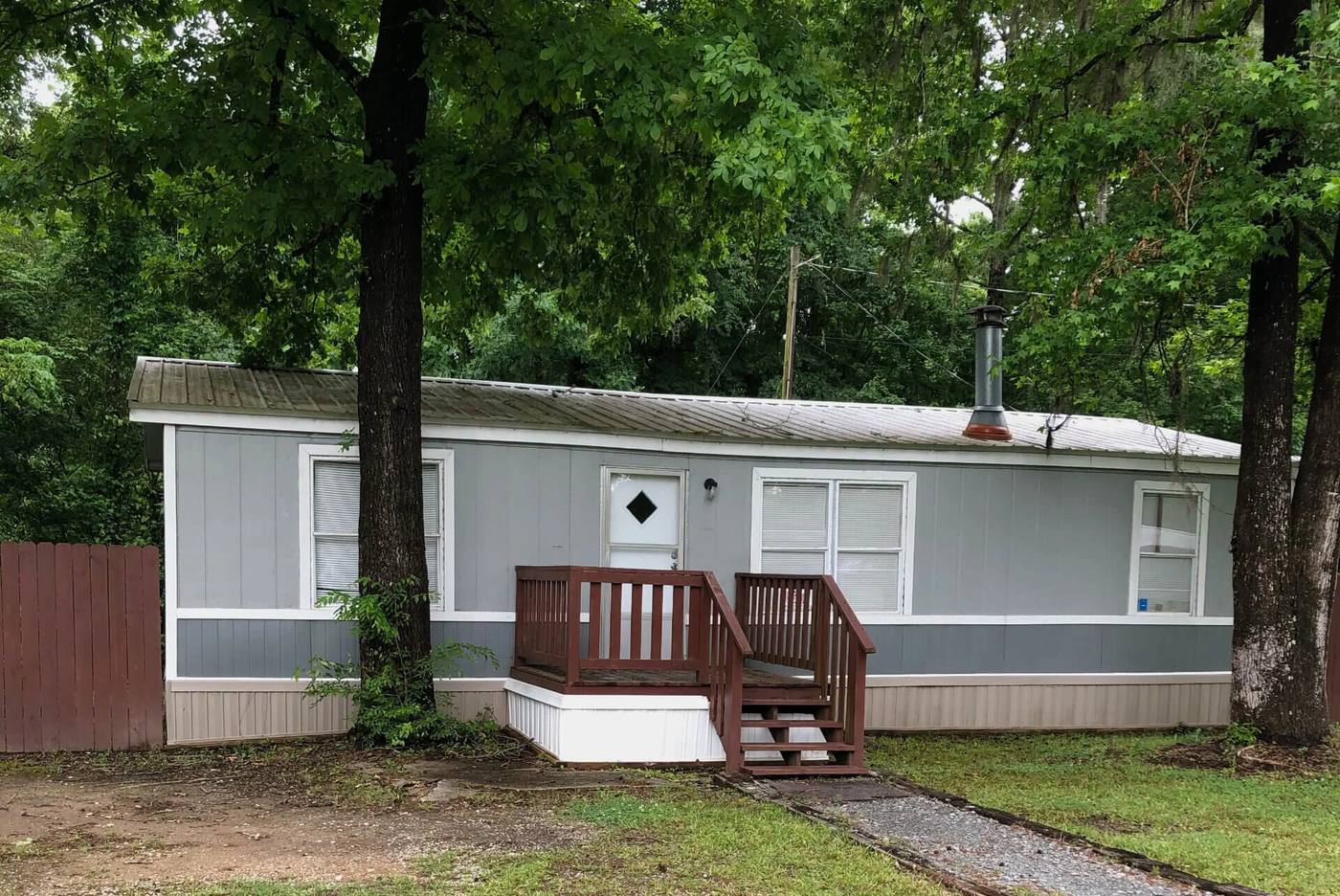 Blue-gray rental home with a porch